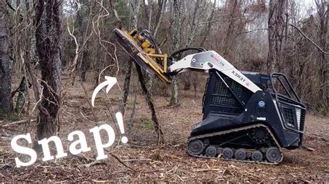 can a skid steer knock down trees|skid steer for fence removal.